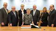 Final sitting: Commissioners and Dr Marie-Louise Ayers, the Director-General of the National Library with the Message to Australia book